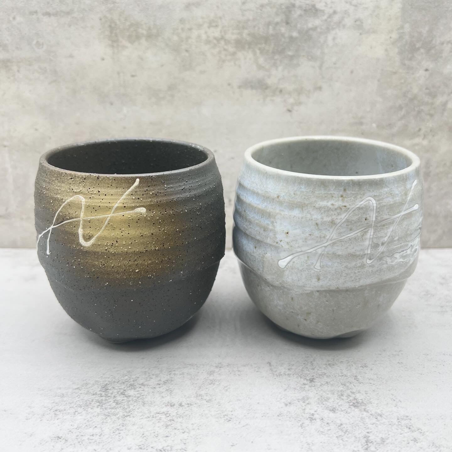 Inoue Tea Ishin Iga Black Mino-yaki Yunomi - Japanese Teacup with a traditional design, showcasing a ceramic teacup.