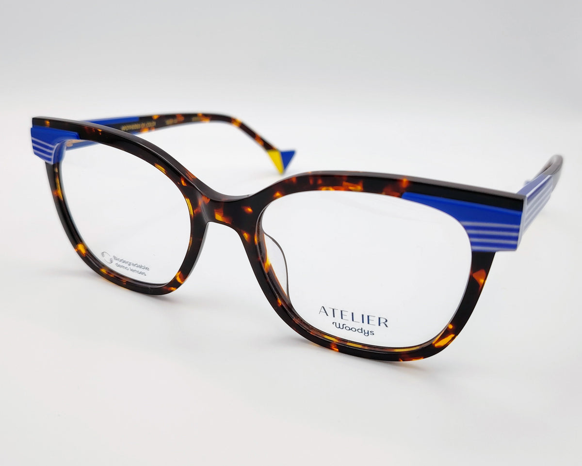 gafas graduadas woodys atelier studio 02 de acetato habana con forma de ojo de gato y detalles arquitectónicos en azul en las esquinas superiores