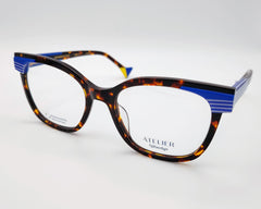 gafas graduadas woodys atelier studio 02 de acetato habana con forma de ojo de gato y detalles arquitectónicos en azul en las esquinas superiores